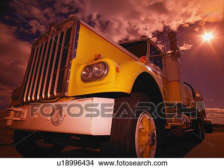 Closeup of a yellow semi View Large Photo Image Picture - Closeup of a yellow semi. Fotosearch