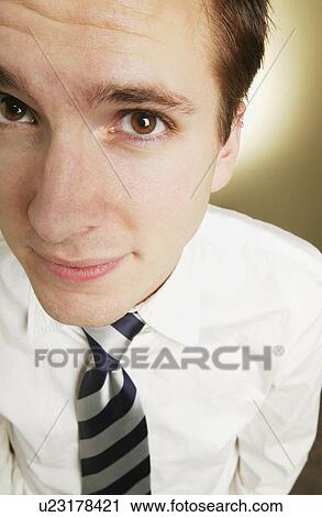 Stock Image - Closeup of businessman's face. Fotosearch