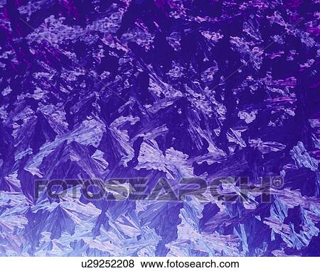 Stock Photo - Closeup of ice crystals on glass. Fotosearch