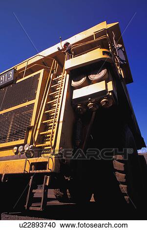 Stock Image - Closeup view of front of ore truck. Fotosearch