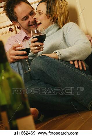 Stock Photo - Couple celebrating together. Fotosearch