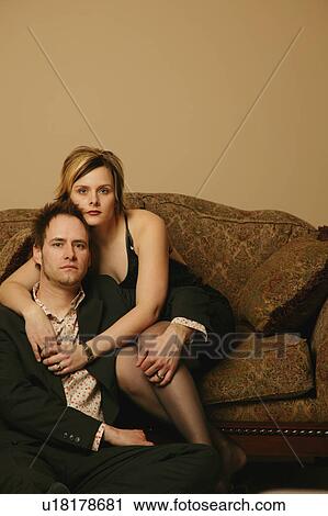 Couple embrace while sitting View Large Photo Image Stock Image - Couple embrace while sitting. Fotosearch
