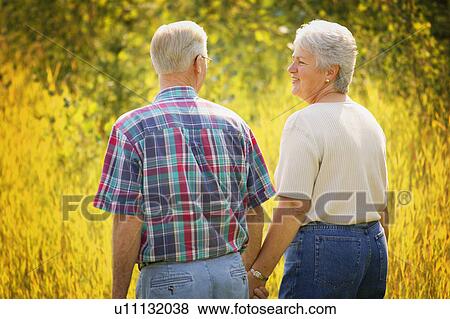 Couple enjoy a walk View Large Photo Image Stock Photo - Couple enjoy a walk. Fotosearch