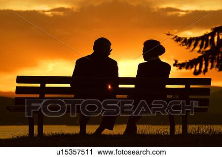 Couple enjoy sunset View Large Photo Image Stock Image - Couple enjoy sunset. Fotosearch