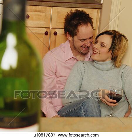 Couple enjoys a drink View Large Photo Image Stock Photo - Couple enjoys a drink. Fotosearch