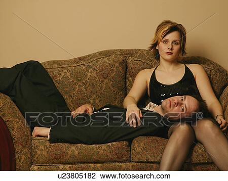 Couple hang out on the sofa View Large Photo Image Stock Image - Couple hang out on the sofa. Fotosearch