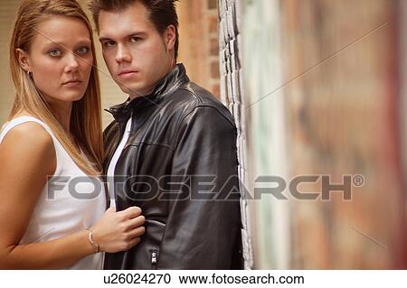 Stock Image - Couple holding each other. Fotosearch
