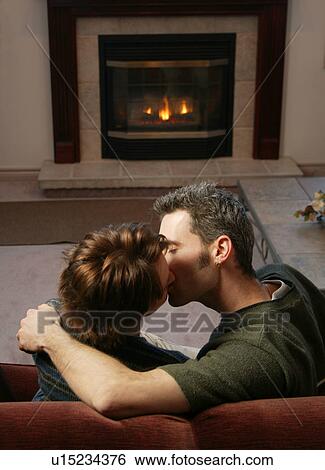 Couple kisses by fire View Large Photo Image Stock Photograph - Couple kisses by fire. Fotosearch
