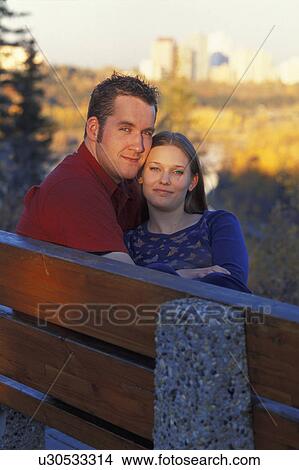 Couple on a park bench View Large Photo Image Picture - Couple on a park bench. Fotosearch