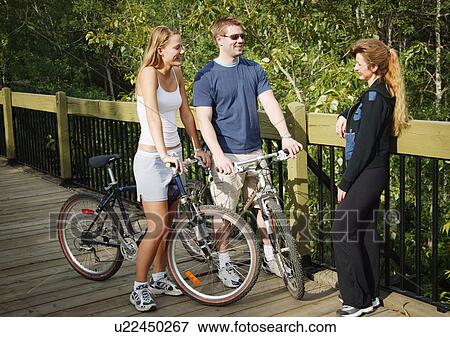Stock Photo - Couple on bikes. Fotosearch