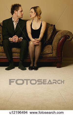 Picture - Couple sitting side by side. Fotosearch