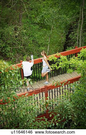 Couple stops for a break View Large Photo Image Stock Photograph - Couple stops for a break. Fotosearch