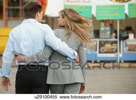 Stock Photography - Couple walking in a market. Fotosearch