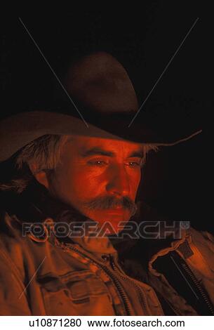 Stock Image - Cowboy around campfire. Fotosearch