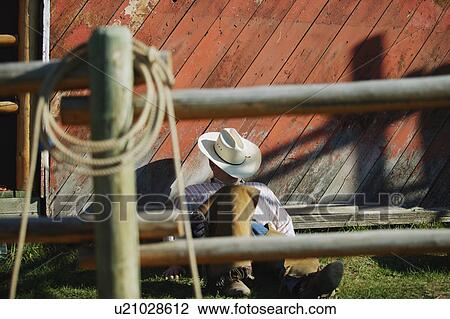 Stock Image - Cowboy takes a nap. Fotosearch