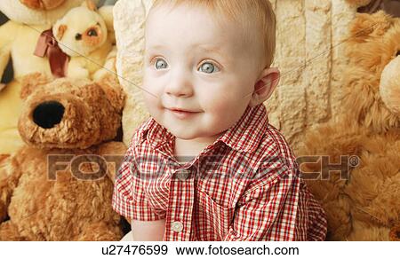 Stock Photo - Cute baby with teddy bear. Fotosearch