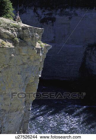 Cyclist looking over cliff View Large Photo Image Picture - Cyclist looking over cliff. Fotosearch