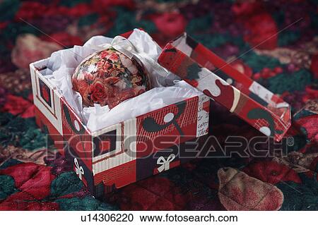 Stock Image - Decorative Christmas ball in gift box. Fotosearch