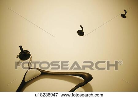 Stock Photo - Empty hanger on the wall. Fotosearch