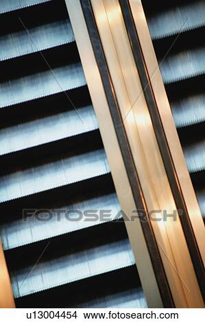 Escalator in a building View Large Photo Image Picture - Escalator in a building. Fotosearch