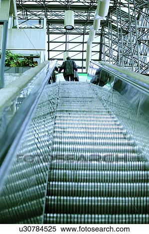 Escalator with businessman at top View Large Photo Image Stock Photography - Escalator with businessman at top. Fotosearch