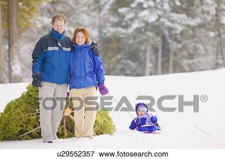 Stock Photo - Family finds a Christmas tree. Fotosearch