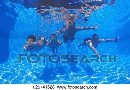 Stock Photo - Family group in swimming pool. Fotosearch