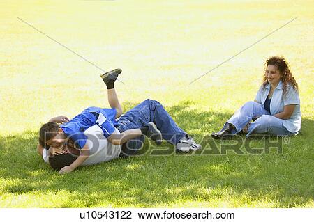 Stock Image - Family plays outside. Fotosearch