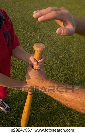 Father and boy's arms with baseball bat View Large Photo Image Stock Photo - Father and boy's arms with baseball bat. Fotosearch