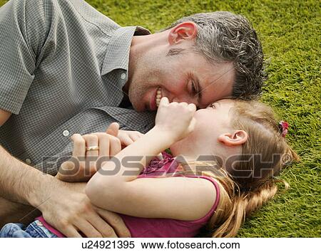 Father and daughter playing together View Large Photo Image Stock Photography - Father and daughter playing together. Fotosearch