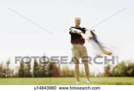 Father swings child around View Large Photo Image Stock Image - Father swings child around. Fotosearch