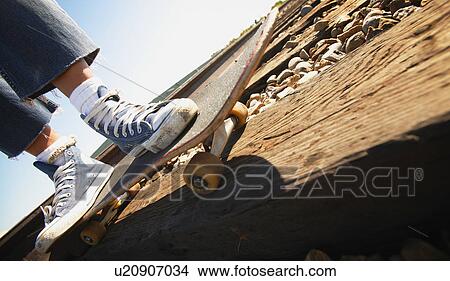 Feet on skateboard View Large Photo Image Picture - Feet on skateboard. Fotosearch