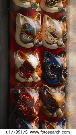 Stock Image - Feline masks used in masquerade for carnival in Venice Italy Europe. Fotosearch