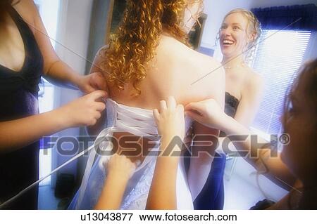Stock Photo - Getting dressed. Fotosearch
