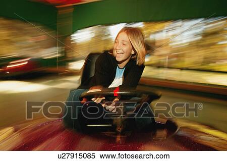 Stock Photography - Girl at an amusement park. Fotosearch
