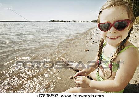 Stock Image - Girl at the beach. Fotosearch