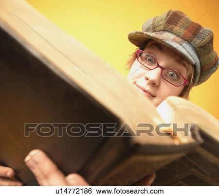 Stock Photograph - Girl reads a book. Fotosearch