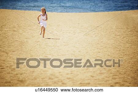 Girl runs on the beach View Large Photo Image Stock Image - Girl runs on the beach. Fotosearch