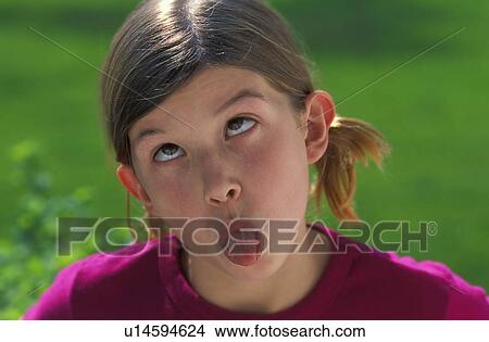Picture - Girl sticking tongue out. Fotosearch