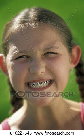 Stock Photography - Girl with funny smile. Fotosearch