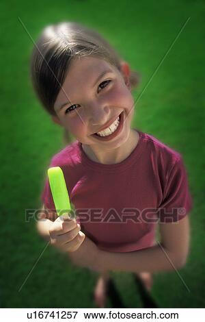 Girl with popsicle View Large Photo Image Stock Photo - Girl with popsicle. Fotosearch