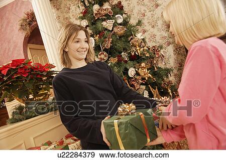 Giving gifts View Large Photo Image Stock Photo - Giving gifts. Fotosearch