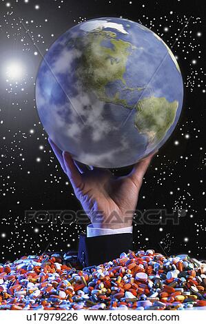 Globe in space held up by hand set in base of pills View Large Photo Image Stock Photograph - Globe in space held up by hand set in base of pills. Fotosearch