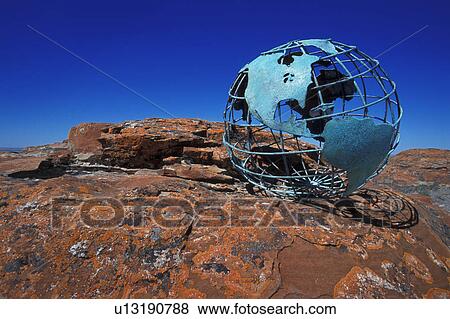 Globe on rock View Large Photo Image Stock Photo - Globe on rock. Fotosearch