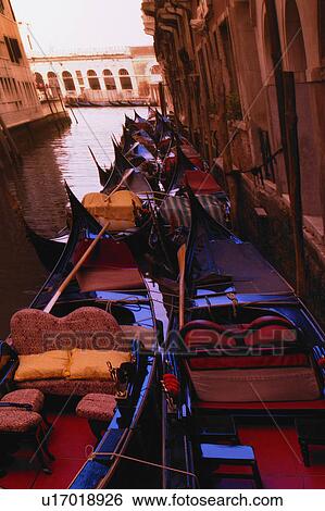 Stock Photograph - Gondolas in canal side street in Venice Italy Europe. Fotosearch