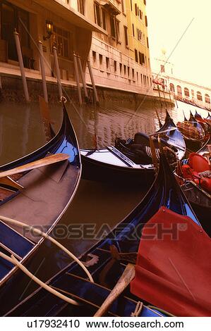 Stock Image - Gondolas in the canal Venice Italy. Fotosearch