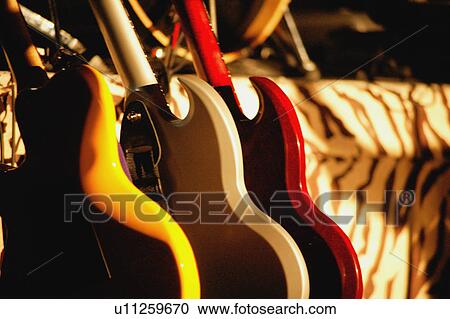 Guitars lined up View Large Photo Image Stock Image - Guitars lined up. Fotosearch