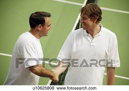 Stock Photo - Handshake before a tennis game. Fotosearch