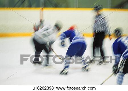 Stock Photo - Ice hockey players at face-off. Fotosearch