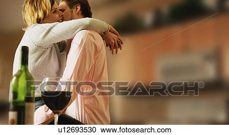 Stock Image - Kissing celebrating. Fotosearch